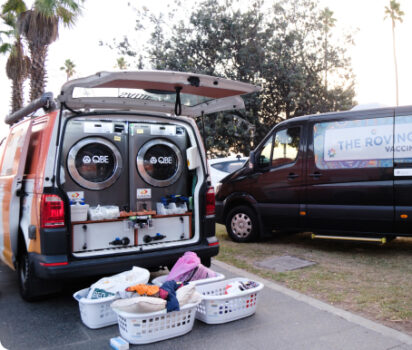 Orange Sky van with laundry